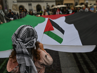 KRAKOW, POLAND - OCTOBER 5:
Pro-Palestinian activists gather in Krakow's UNESCO-listed Old Town for the 'March for Palestine,' calling for a...