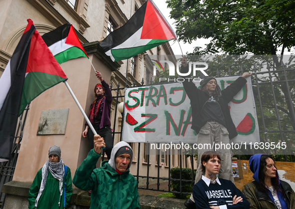 KRAKOW, POLAND - OCTOBER 5:
Pro-Palestinian activists gathered in front of the fence of the Institute of Sociology at Jagiellonian Universit...