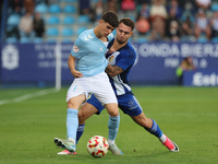 Angel Arcos of Celta Fortuna and Thomas Carrique of SD Ponferradina are in action during the Spanish football 1st Federation Group 1, JOR 7...