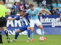 Fer Lopez of Celta Fortuna and Kevin Sibille of SD Ponferradina are in action during the Spanish football 1 Federation Group 1, JOR 7 match...