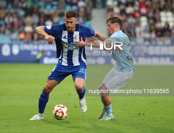 Markel Lozano of SD Ponferradina and Oscar Marcos of Celta are in action during the Spanish Football 1 Federation Group 1, JOR 7 match betwe...