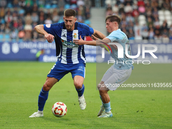 Markel Lozano of SD Ponferradina and Oscar Marcos of Celta are in action during the Spanish Football 1 Federation Group 1, JOR 7 match betwe...