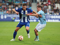 Markel Lozano of SD Ponferradina and Oscar Marcos of Celta are in action during the Spanish Football 1 Federation Group 1, JOR 7 match betwe...