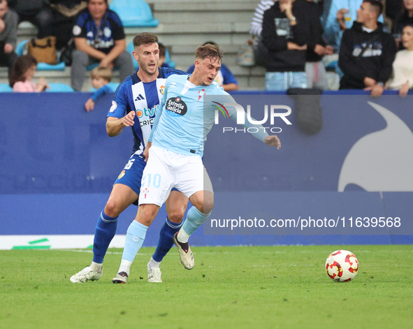 David de la Iglesia Dela of Celta Fortuna and Markel Lozano of SD Ponferradina are in action during the Spanish football 1 Federation Group...