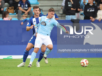 David de la Iglesia Dela of Celta Fortuna and Markel Lozano of SD Ponferradina are in action during the Spanish football 1 Federation Group...