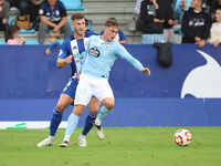 David de la Iglesia Dela of Celta Fortuna and Markel Lozano of SD Ponferradina are in action during the Spanish football 1 Federation Group...