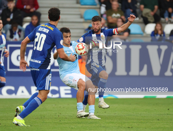 Miguel Roman of Celta Fortuna and Borja Valle of SD Ponferradina are in action during the Spanish football 1 Federation Group 1, JOR 7, betw...