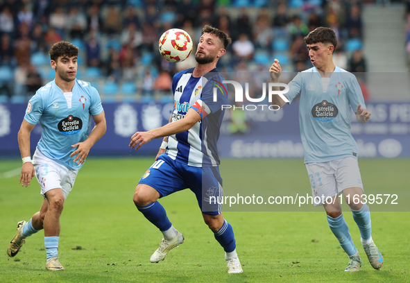 Borja Valle of SD Ponferradina, Tincho of Celta Fortuna, and Angel Arcos of Celta Fortuna are in action during the Spanish football 1st Fede...