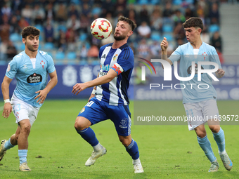 Borja Valle of SD Ponferradina, Tincho of Celta Fortuna, and Angel Arcos of Celta Fortuna are in action during the Spanish football 1st Fede...