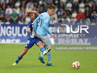 Manu Fernandez of Celta Fortuna and Alex Costa of SD Ponferradina play during the Spanish football 1 Federation Group 1, JOR 7 match between...