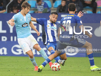 Fer Lopez of Celta Fortuna and Kevin Sibille of SD Ponferradina are in action during the Spanish football 1 Federation Group 1, JOR 7 match...