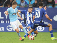 Fer Lopez of Celta Fortuna and Kevin Sibille of SD Ponferradina are in action during the Spanish football 1 Federation Group 1, JOR 7 match...