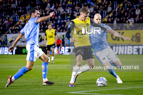 NAC Breda defender Lars Mol, NEC defender Bram Nuytinck, and NEC defender Ivan Marquez are present during the match between NAC and NEC at t...