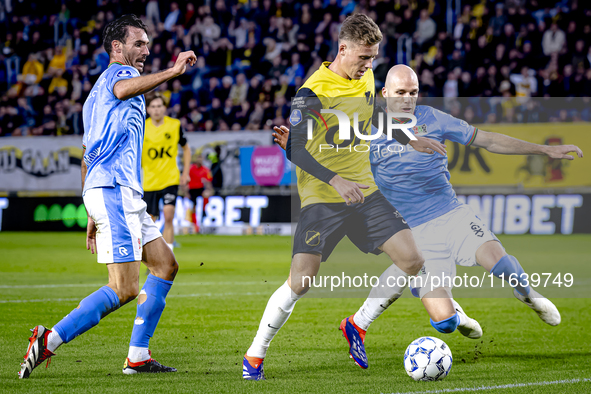 NAC Breda defender Lars Mol, NEC defender Bram Nuytinck, and NEC defender Ivan Marquez are present during the match between NAC and NEC at t...