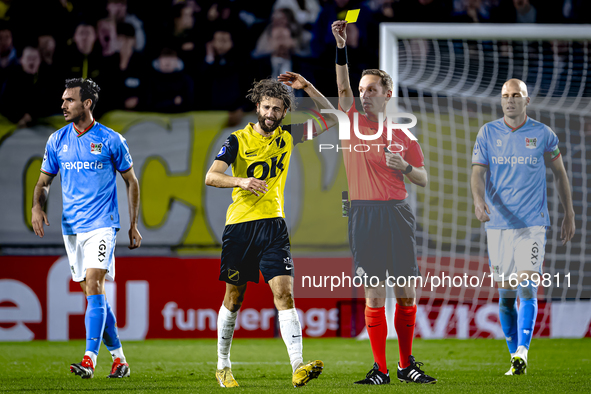 NAC Breda defender Jan van den Berg receives a yellow card from Referee Ingmar Oostrom during the match between NAC and NEC at the NAC Rat V...