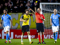 NAC Breda defender Jan van den Berg receives a yellow card from Referee Ingmar Oostrom during the match between NAC and NEC at the NAC Rat V...