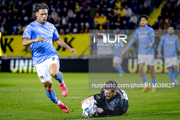 NEC forward Kento Shiogai and NAC Breda goalkeeper Daniel Bielica participate in the match between NAC and NEC at the NAC Rat Verleghstadium...