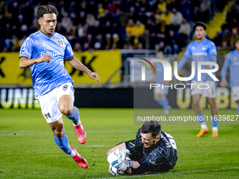 NEC forward Kento Shiogai and NAC Breda goalkeeper Daniel Bielica participate in the match between NAC and NEC at the NAC Rat Verleghstadium...