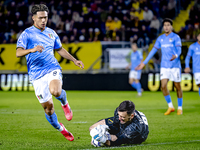 NEC forward Kento Shiogai and NAC Breda goalkeeper Daniel Bielica participate in the match between NAC and NEC at the NAC Rat Verleghstadium...