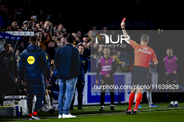 NAC Breda goalkeeping coach Gabor Babos receives a red card from referee Ingmar Oostrom during the match between NAC and NEC at the NAC Rat...