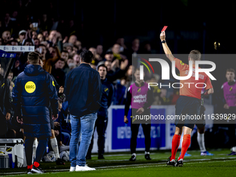 NAC Breda goalkeeping coach Gabor Babos receives a red card from referee Ingmar Oostrom during the match between NAC and NEC at the NAC Rat...