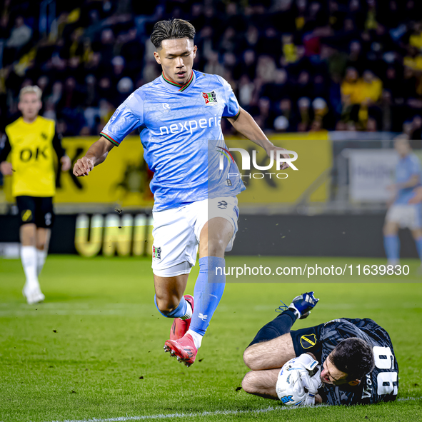 NEC forward Kento Shiogai and NAC Breda goalkeeper Daniel Bielica participate in the match between NAC and NEC at the NAC Rat Verleghstadium...