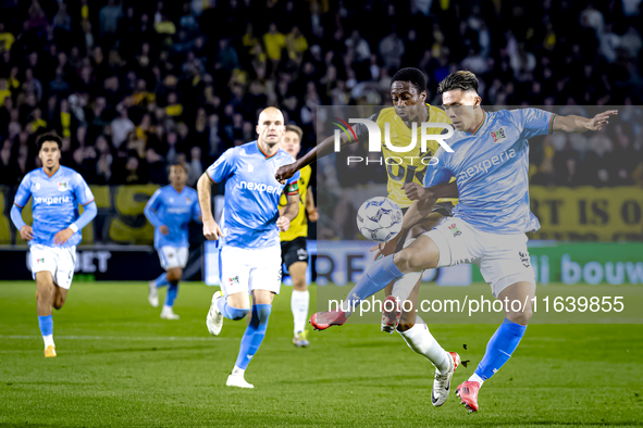 NAC Breda defender Terence Kongolo and NEC forward Kento Shiogai participate in the match between NAC and NEC at the NAC Rat Verleghstadium...