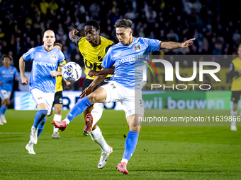 NAC Breda defender Terence Kongolo and NEC forward Kento Shiogai participate in the match between NAC and NEC at the NAC Rat Verleghstadium...