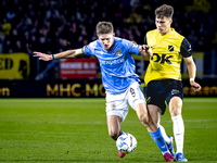 NEC midfielder Mees Hoedemakers and NAC Breda forward Kacper Kostorz play during the match between NAC and NEC at the NAC Rat Verlegh Stadiu...