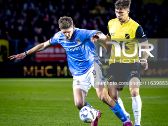 NEC midfielder Mees Hoedemakers and NAC Breda forward Kacper Kostorz play during the match between NAC and NEC at the NAC Rat Verlegh Stadiu...