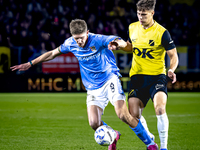 NEC midfielder Mees Hoedemakers and NAC Breda forward Kacper Kostorz play during the match between NAC and NEC at the NAC Rat Verlegh Stadiu...