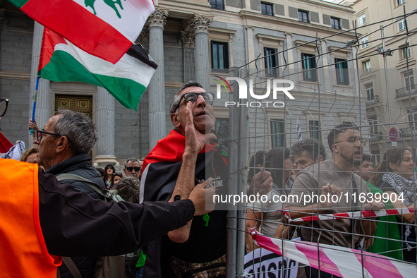 About 30,000 people with Palestinian and Lebanese flags walk the streets of Madrid, Spain, on October 5, 2024, to protest Israel's attacks o...