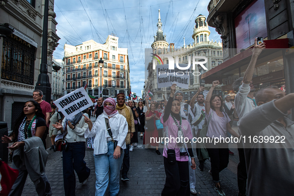 About 30,000 people with Palestinian and Lebanese flags walk the streets of Madrid, Spain, on October 5, 2024, to protest Israel's attacks o...