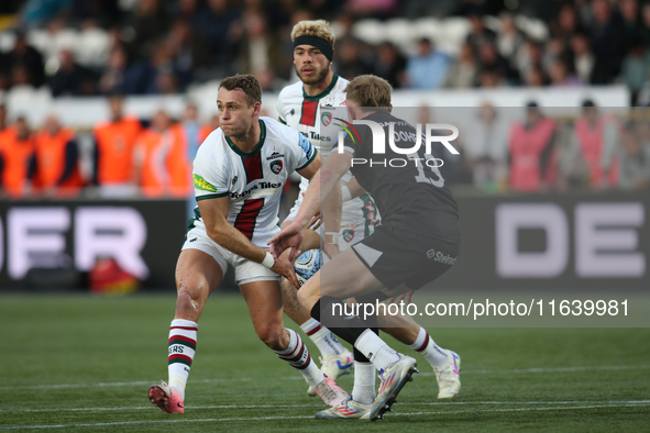 Leicester Tigers' Jamie Shillcock passes a ball under pressure during the Gallagher Premiership match between Newcastle Falcons and Leiceste...