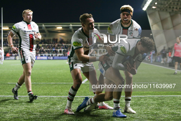 Leicester Tigers players embrace Leicester Tigers' Will Wand after his try during the Gallagher Premiership match between Newcastle Falcons...