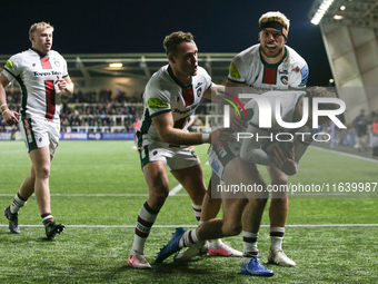 Leicester Tigers players embrace Leicester Tigers' Will Wand after his try during the Gallagher Premiership match between Newcastle Falcons...