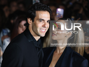 Kaka and Carolina Dias attend the Emporio Armani Fashion Show during the Milan Womenswear Spring/Summer 2025 in Milan, Italy, on September 1...