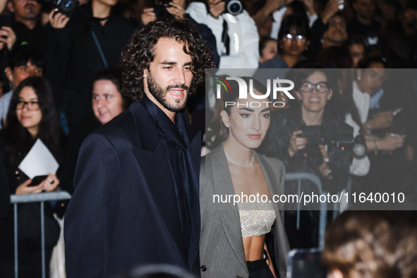 Gianmarco Tamberi and Chiara Bontempi attend the Emporio Armani Fashion Show during the Milan Womenswear Spring/Summer 2025 in Milan, Italy,...