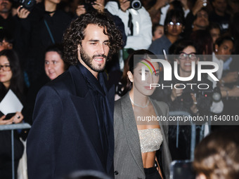 Gianmarco Tamberi and Chiara Bontempi attend the Emporio Armani Fashion Show during the Milan Womenswear Spring/Summer 2025 in Milan, Italy,...