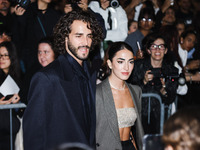 Gianmarco Tamberi and Chiara Bontempi attend the Emporio Armani Fashion Show during the Milan Womenswear Spring/Summer 2025 in Milan, Italy,...