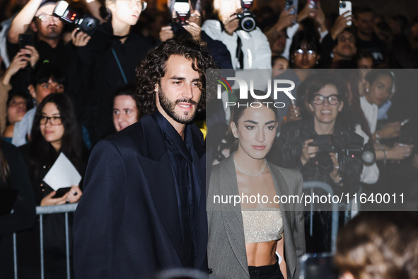 Gianmarco Tamberi and Chiara Bontempi attend the Emporio Armani Fashion Show during the Milan Womenswear Spring/Summer 2025 in Milan, Italy,...