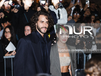 Gianmarco Tamberi and Chiara Bontempi attend the Emporio Armani Fashion Show during the Milan Womenswear Spring/Summer 2025 in Milan, Italy,...