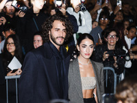 Gianmarco Tamberi and Chiara Bontempi attend the Emporio Armani Fashion Show during the Milan Womenswear Spring/Summer 2025 in Milan, Italy,...