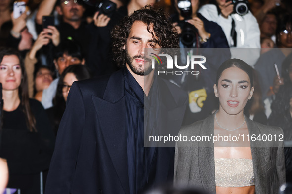 Gianmarco Tamberi and Chiara Bontempi attend the Emporio Armani Fashion Show during the Milan Womenswear Spring/Summer 2025 in Milan, Italy,...