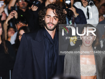 Gianmarco Tamberi and Chiara Bontempi attend the Emporio Armani Fashion Show during the Milan Womenswear Spring/Summer 2025 in Milan, Italy,...