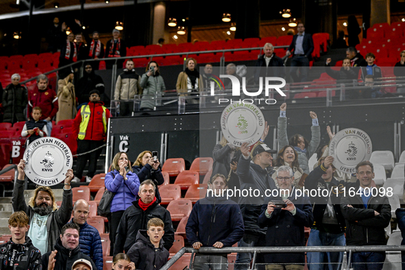 FC Utrecht fans hold the championship trophy during the match between Utrecht and RKC at Stadium de Galgenwaard for the 2024-2025 season in...