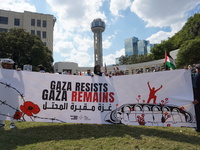 Hundreds of people join a demonstration in solidarity with the Palestinian people at The Grassy Knoll to mark the first anniversary of the w...