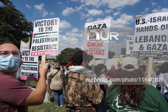 Hundreds of people join a demonstration in solidarity with the Palestinian people at The Grassy Knoll to mark the first anniversary of the w...