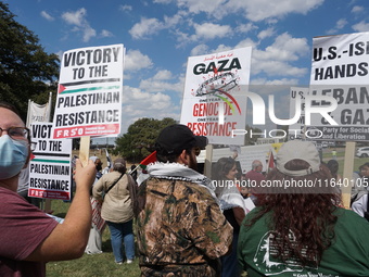 Hundreds of people join a demonstration in solidarity with the Palestinian people at The Grassy Knoll to mark the first anniversary of the w...