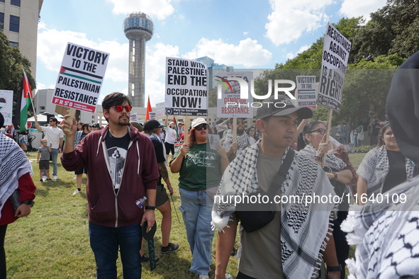 Hundreds of people join a demonstration in solidarity with the Palestinian people at The Grassy Knoll to mark the first anniversary of the w...